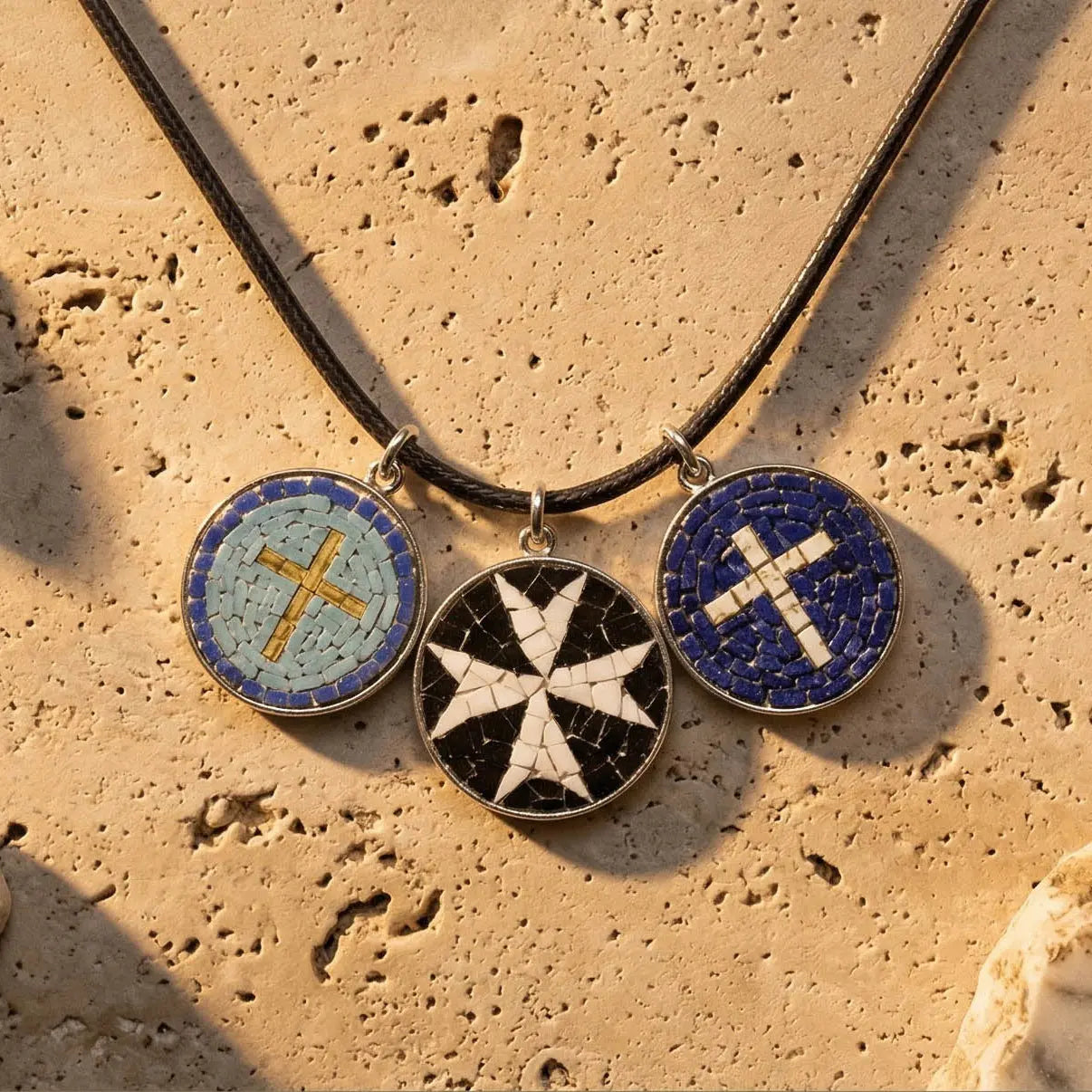 Close-up of mosaic pendant surface with polychrome marble and glass enamel