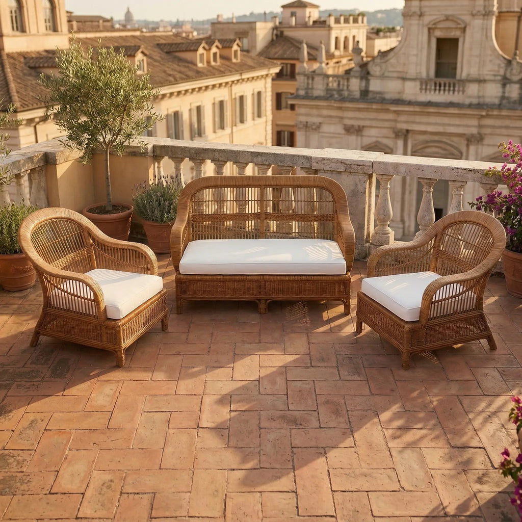 Handwoven rattan sofa and armchair set on an outdoor terrace, Made in Rome